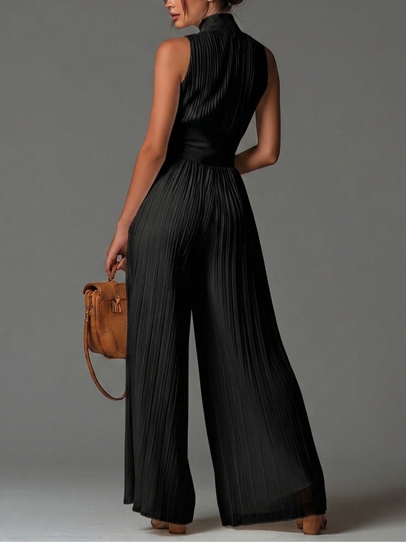 Tuta nera in chiffon con scollo a V, senza maniche, zip e pieghe a gamba larga