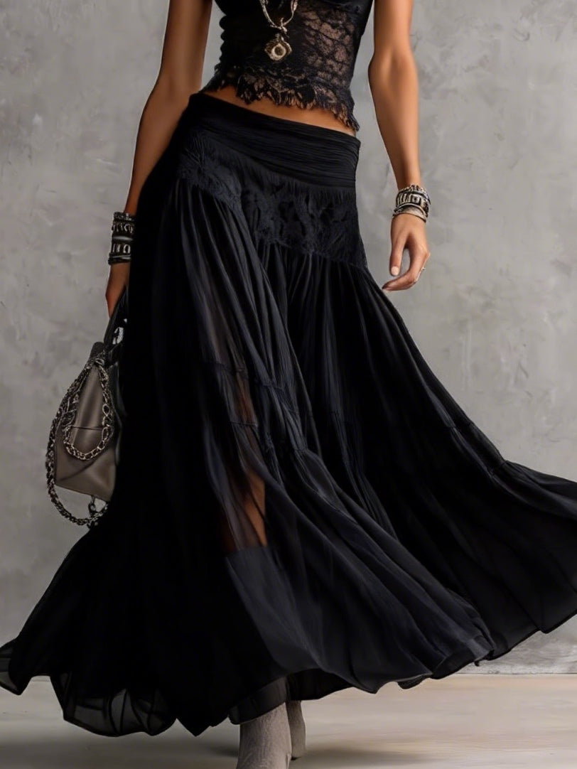 Set nero con top a pannelli in pizzo trasparente e gonna maxi plissettata